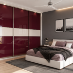 Sliding Wardrobe Design with Bold Wine Red Acrylic Shutters